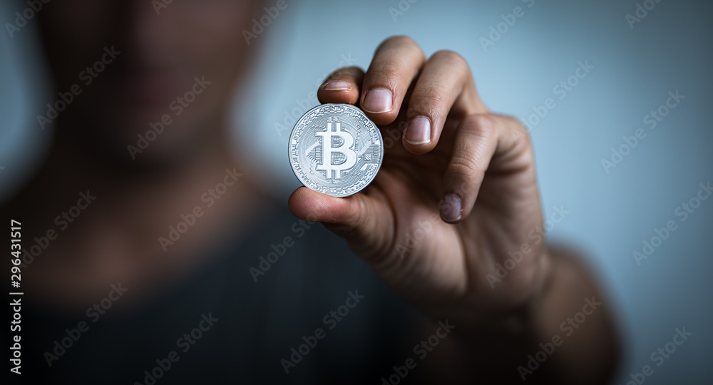Bitcoin - Cryptocurrency concept - cryptocurrency being held as a value conserving asset as well a mean of swift exchange having a fungible, antiinflationary, decentralized nature Bitcoin - Cryptocurrency concept - cryptocurrency being held as a value conserving asset as well a mean of swift exchange having a fungible, antiinflationary, decentralized nature