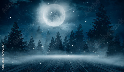  Dark abstract winter forest background. Wooden floor, snow, fog. Dark night background in the forest with moonlight. Night view, magic