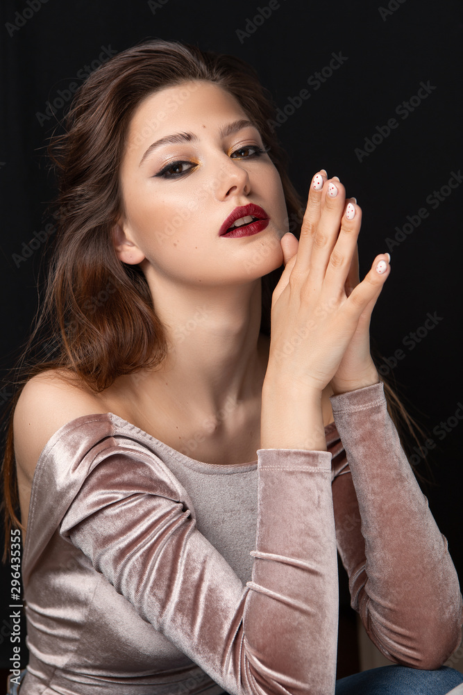 Beauty portrait of a girl with makeup with red lips Beauty portrait of a girl with makeup with red lips