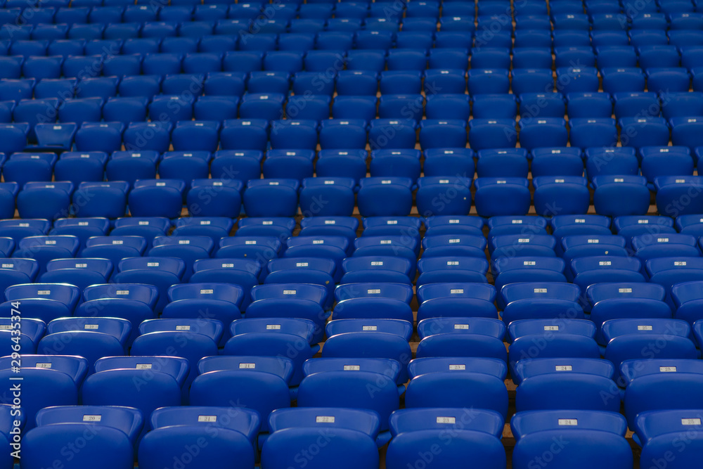 Blue numbered seats on the stadium stands
