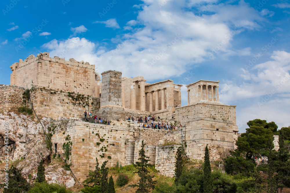 Tourists visiting the Acropolis in a beautiful early spring day seen from the Areopagus Hill in Athens