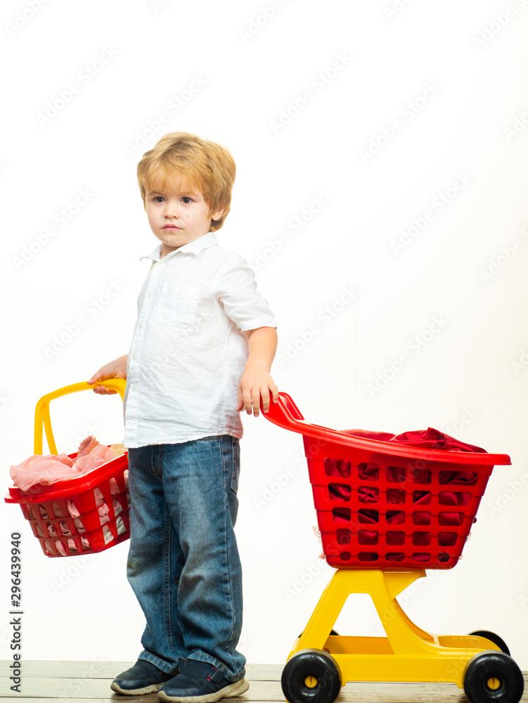 Cute buyer customer client hold shopping cart. Kids store. Boy child shopping. Big purchase. Kid hold plastic shopping basket toy. Buy with discount. Family shopping. Buy products. Play shop Cute buyer customer client hold shopping cart. Kids store. Boy child shopping. Big purchase. Kid hold plastic shopping basket toy. Buy with discount. Family shopping. Buy products. Play shop