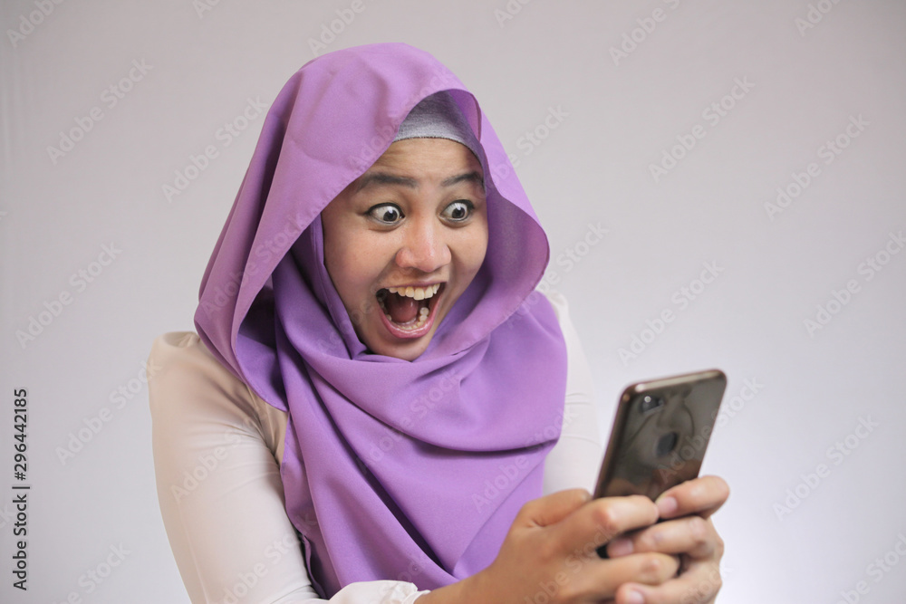Young Muslim Woman Get Good News on Her Phone Young Muslim Woman Get Good News on Her Phone