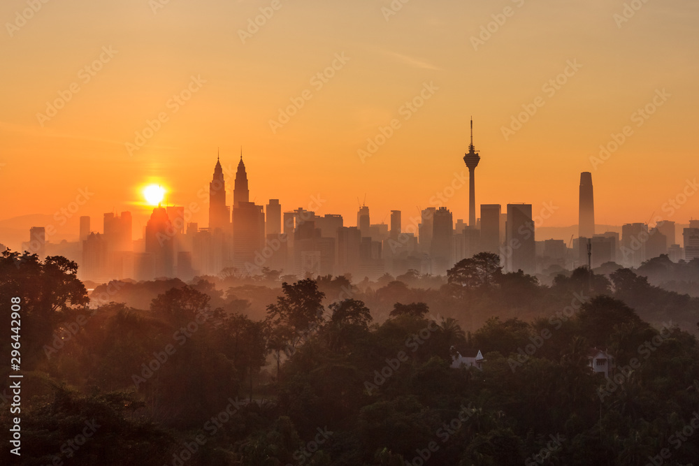 Naklejka premium majestic sunrise over kuala lumpur, malaysia city skyline