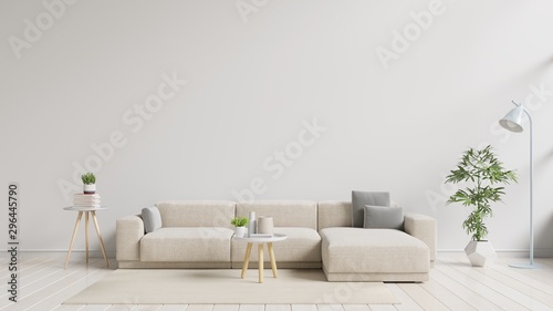 Modern living room interior with sofa and green plants,lamp,table on white wall background. photo