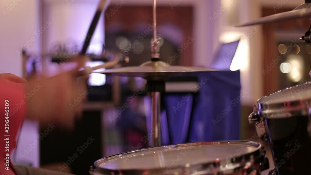 Concert at the club, at a party. Rock band, cover band, guitar, drums, synthesizer, singer, performer. Musical show. Drummers close up. Concert at the club, at a party. Rock band, cover band, guitar, drums, synthesizer, singer, performer. Musical show. Drummers close up.