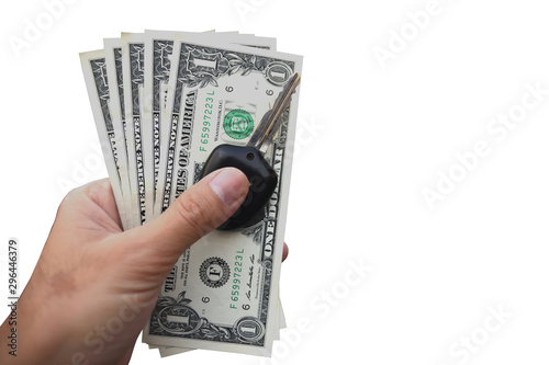 Hand holding dollar and key of car on white background
