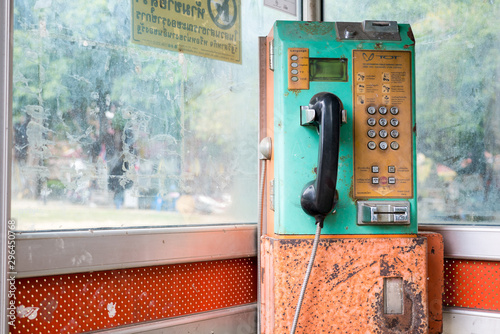 Old green telephone cabin in Thailand