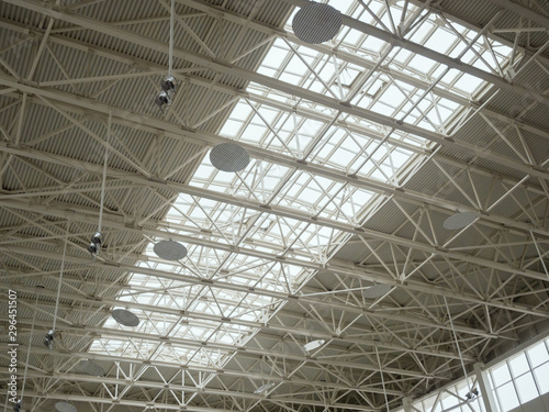 Openwork metal construction of a huge room roof. Theme of modern opportunities for the construction of public facilities