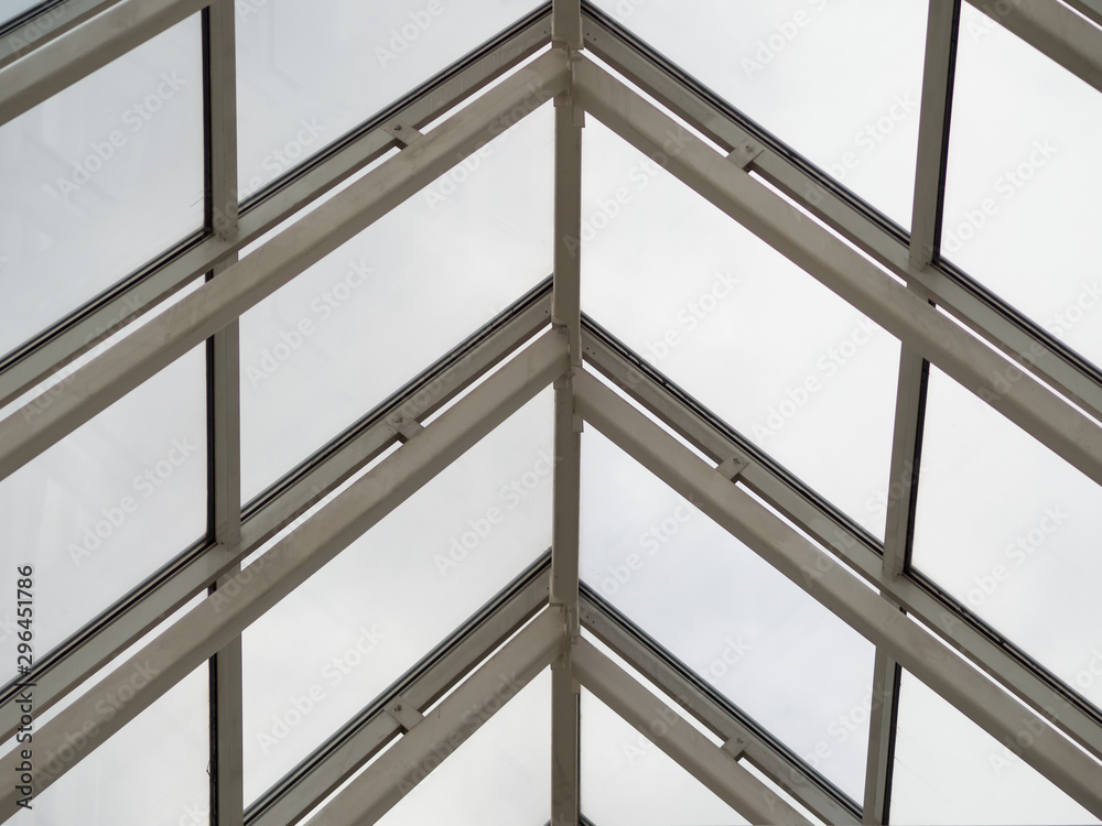 The metal parts of the glass roof form a triangular structure. Arrows turn up. Theme of modern opportunities for the construction of public facilities The metal parts of the glass roof form a triangular structure. Arrows turn up. Theme of modern opportunities for the construction of public facilities