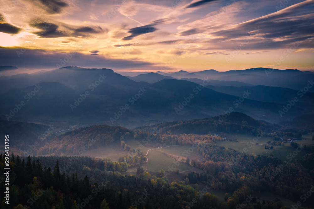 Fog on the mountains during sunset in autumn
