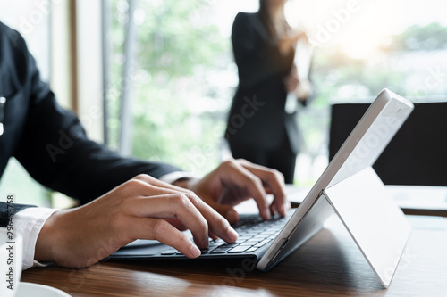 Φωτογραφία Businessman or Accountant working with tablet  for investigation of corruption account and business team working background