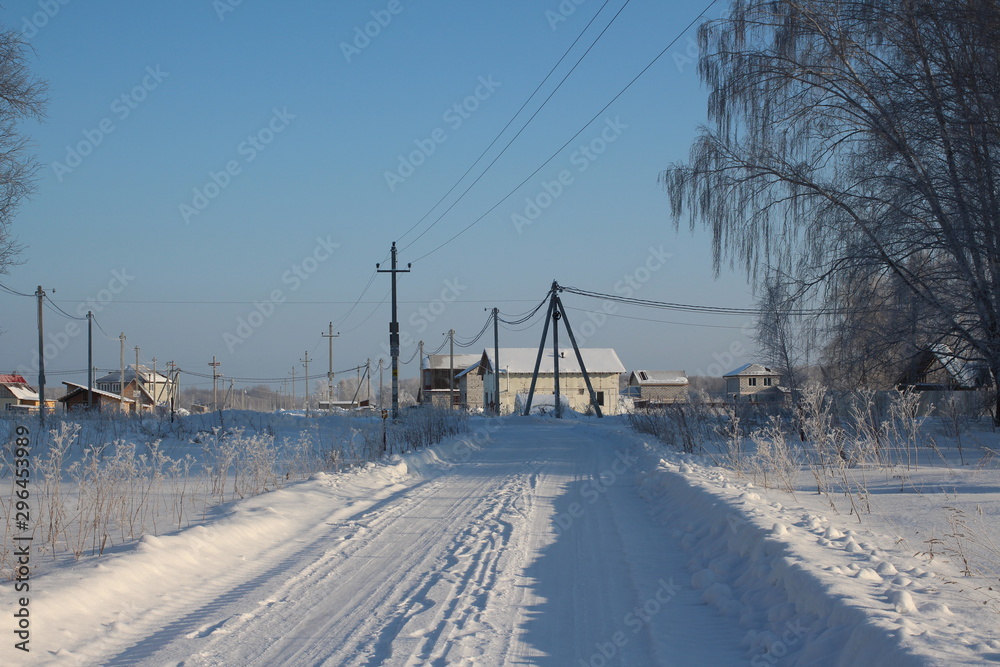 cleaned road winter travel to the Siberian village in the snow in winter cleaned road winter travel to the Siberian village in the snow in winter