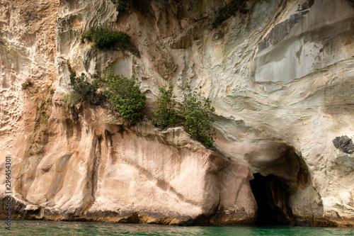 Cliffs and rock formations along the coastline of Cathedral Cove photo