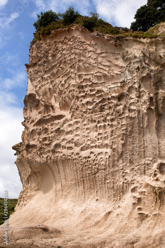 Cliffs and rock formations along the coastline of Cathedral Cove photo