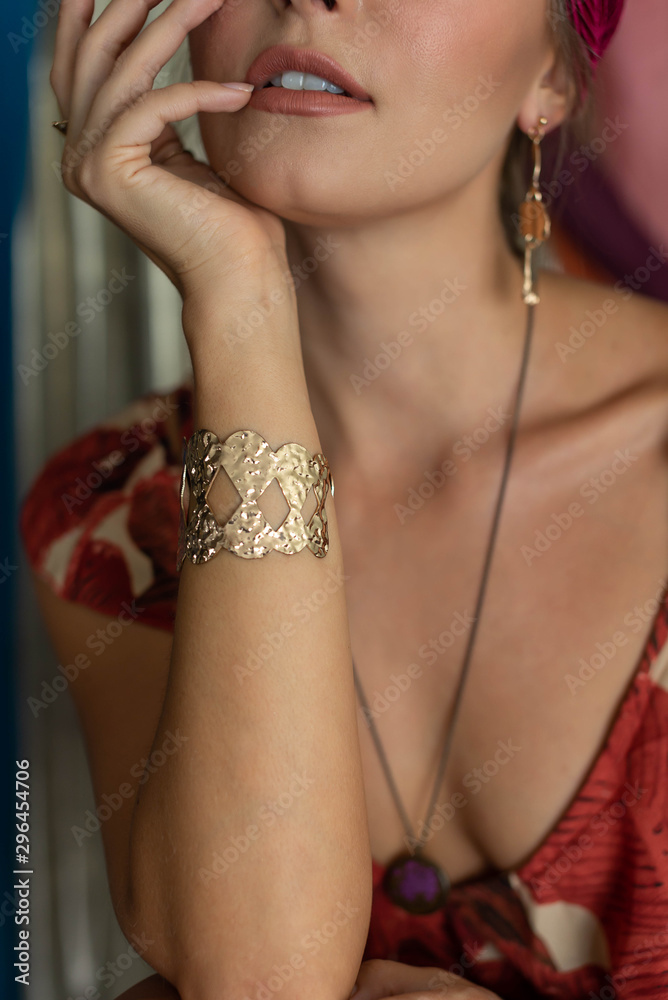 Golden bracelet on the hand. Female. Jewelery. Lifestyle. Close up.