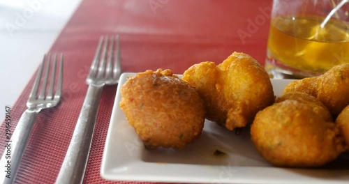 Accras de Morue, healthy fritter Caribbean food. salt fish based gastronomy, these cod balls appetizer cooked in oil are beautiful and delicious holiday meal in restaurant.