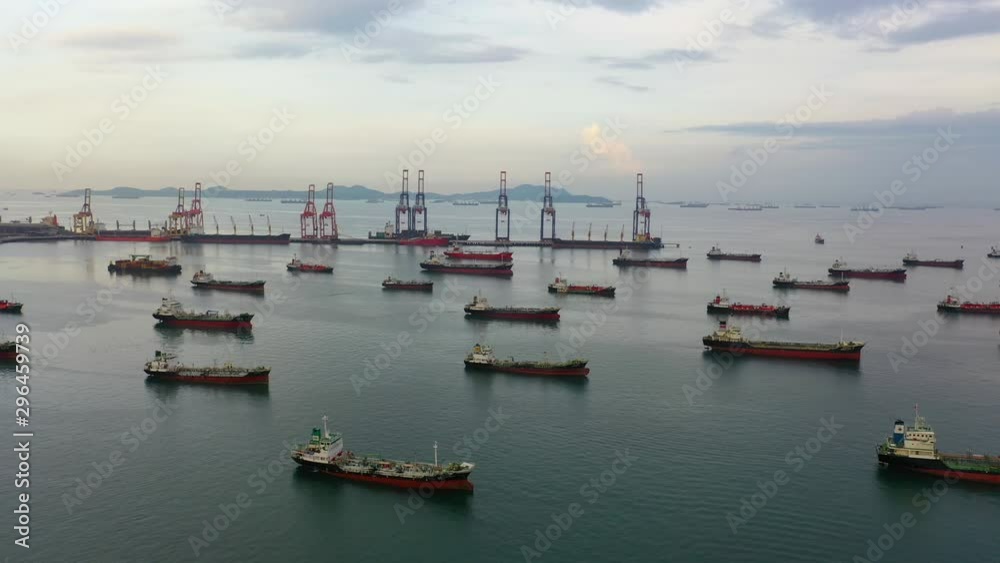 Aerial top view of the ship carrying the lpg and oil tanker in the sea port with vessel logistics. For energy export and import business for transportation trade. footage video 4k B-roll scene. Aerial top view of the ship carrying the lpg and oil tanker in the sea port with vessel logistics. For energy export and import business for transportation trade. footage video 4k B-roll scene.