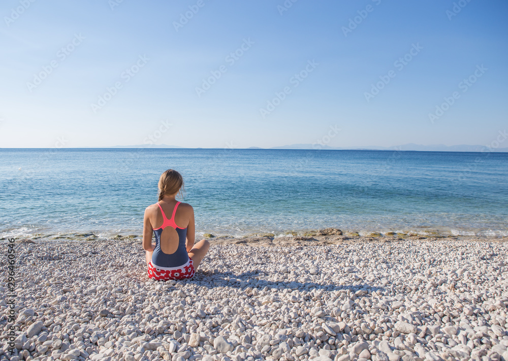  woman enjoy tropical vacation. Resting relaxing on the  beach near sea. Greece