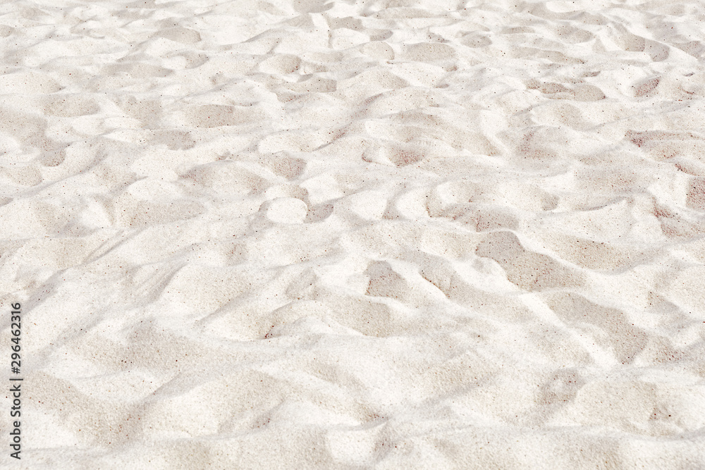 Beach sand natural color background. Top down aerial view of white sand dunes. Sandy surface pattern. Texture of soft material. Design reference for beach sport field. Abstract wallpaper Beach sand natural color background. Top down aerial view of white sand dunes. Sandy surface pattern. Texture of soft material. Design reference for beach sport field. Abstract wallpaper