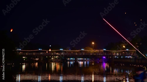 4K time lapse video of colourful Mae Ping river in Yee Peng or Loy Krathong festival, Thailand. photo