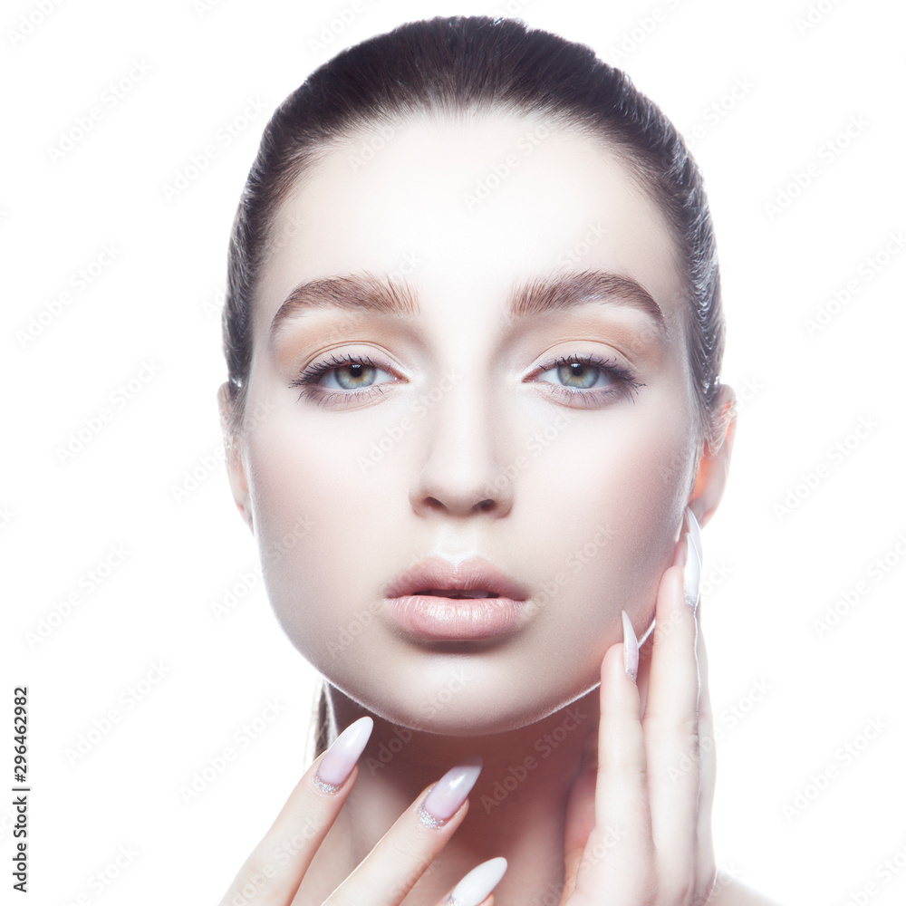 portrait of young beautiful beauty model woman with perfect skin touching face, blue eyes, hair style, nude natural make-up. Skincare facial treatment concept portrait of young beautiful beauty model woman with perfect skin touching face, blue eyes, hair style, nude natural make-up. Skincare facial treatment concept
