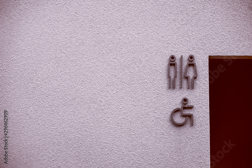 Label of symbol for the toilet for men and women on white background, Direction and navigation signs in the vintage raw concrete wall for lost and found and WC restroom in the building.