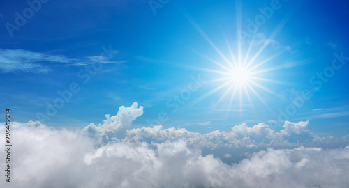 Beautiful of sun shines above the blue sky with clouds in the day