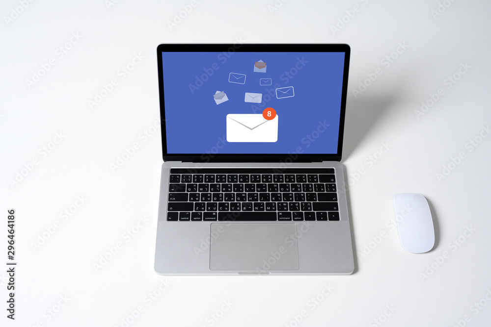 Person using a laptop computer with email communication connection message online and chat on social media with global letters concept. Laptop mockup with clipping path on screen. Person using a laptop computer with email communication connection message online and chat on social media with global letters concept. Laptop mockup with clipping path on screen.