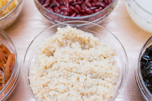 White millet, ingredient of thai dessert in glass bowl, top view, Tub Tim Grob photo