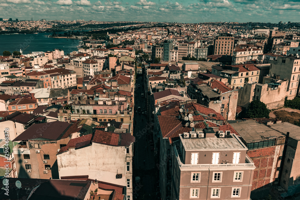 Aerial View from the Galata Tower to rows of residential buildings in a district on a bright cloudy day with vintage look on the image.