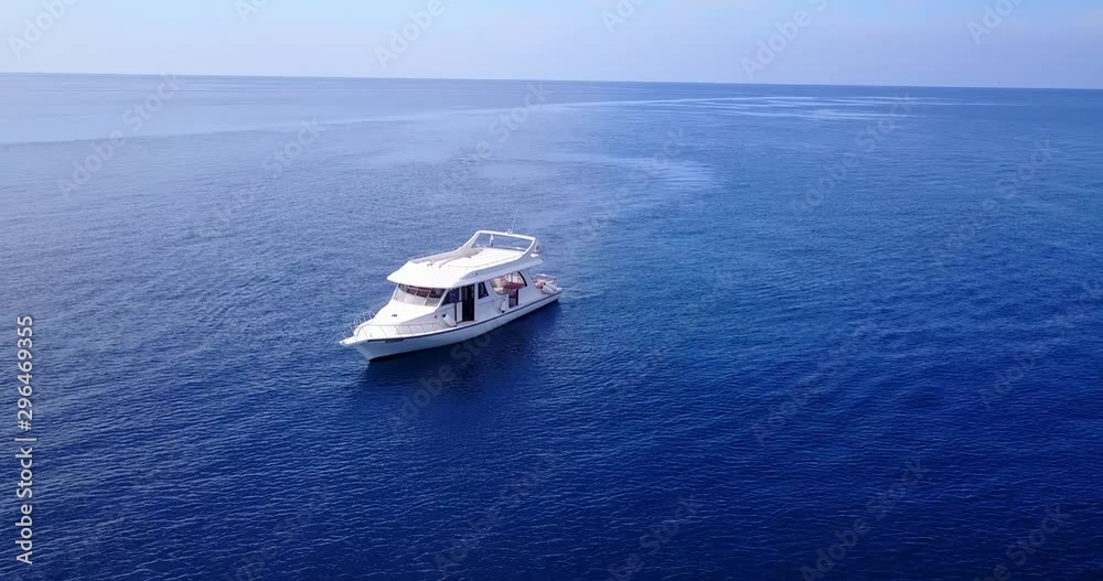 Luxury yacht, tourism. Aerial orbit , deep blue water. Tranquil, calm. Bora Bora. Luxury yacht, tourism. Aerial orbit , deep blue water. Tranquil, calm. Bora Bora.