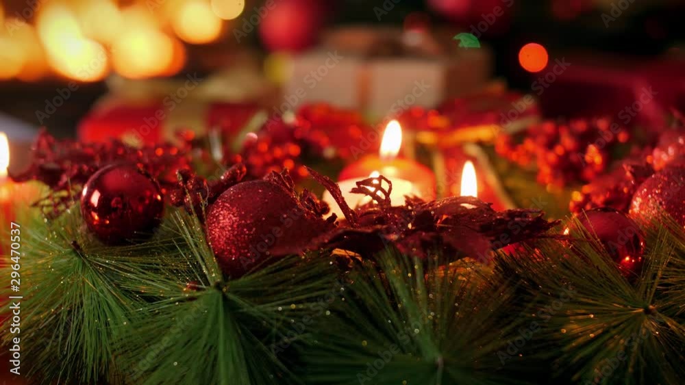 4k dolly video of beautiful advent wreathwith burning candles on Christmas eve. Perfect background or backdrop for Christmas or New Year