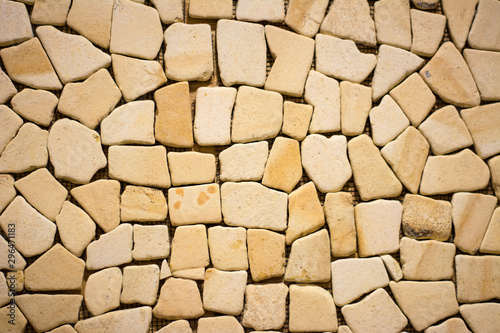 texture of yellow stone wall background pattern