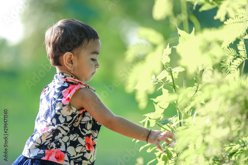 cute indian baby girl playing in the park