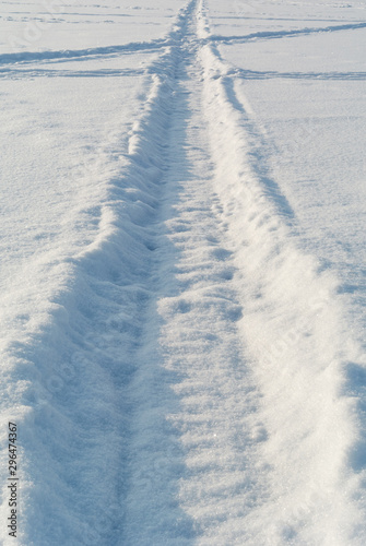 Tracks on winter snow field © alexus