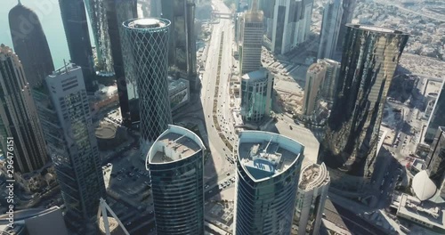 Epic top-down aerial view of Doha, highly developped global city of the future, with high rise buildings and skyscrapers, in Qatar photo