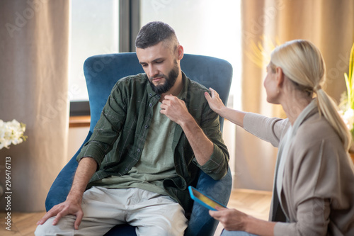 Fototapeta Naklejka Na Ścianę i Meble -  Bearded man feeling better after talking with psychoanalyst