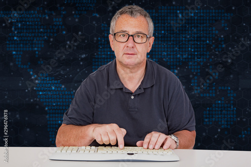 Man sitting at the computer keyboard in front Digital Wall photo