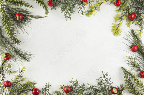 Christmas composition of branches with red apples
