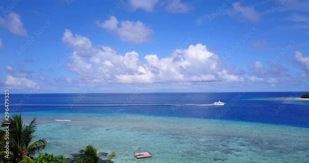 sailing yacht in maldives, tracking drone pan right shot