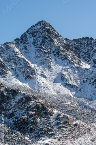 peak of Piz Nuna at Macun Lakes photo