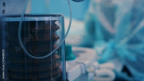 Close up view of anaesthesia machine ventilator and patients monitor inside the operating room. Close-up, blurred background, blue light.