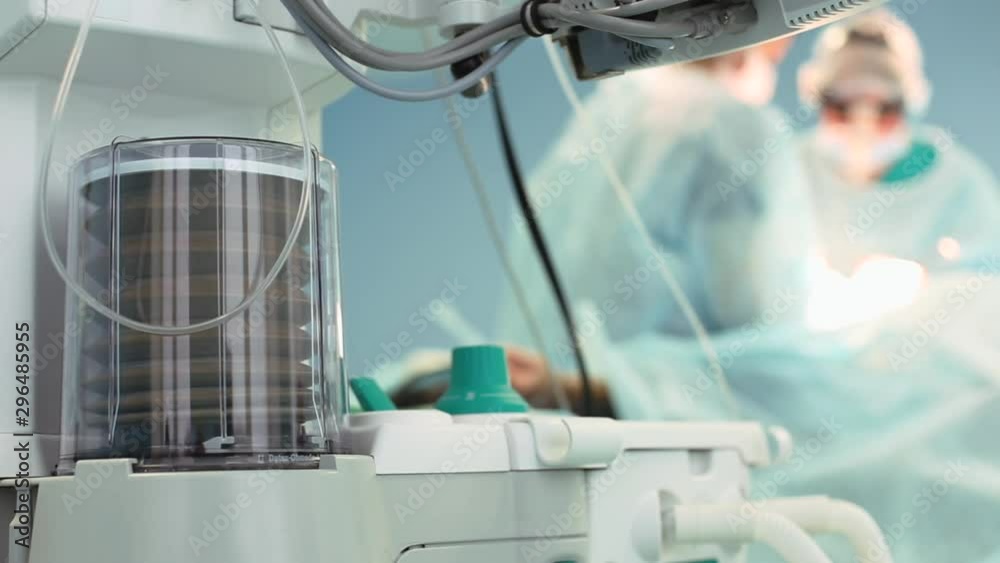 Close up view of anaesthesia machine ventilator and patients monitor inside the operating room. Close-up, blurred background, blue light.