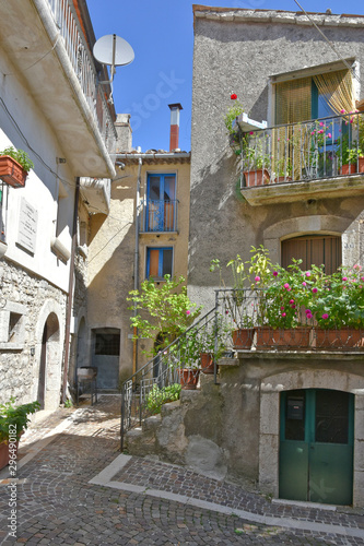 Province of Benevento, Italy, 09/15/2018. A road among the old houses of a mountain village. photo