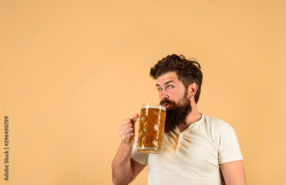 Germany traditions. Celebration oktoberfest festival. Brewery concept. Bearded man drinking beer. Pub and bar. Brewer. Craft beer. Bearded man hold glass with delicious beer. Beer in Germany. Alcohol. Germany traditions. Celebration oktoberfest festival. Brewery concept. Bearded man drinking beer. Pub and bar. Brewer. Craft beer. Bearded man hold glass with delicious beer. Beer in Germany. Alcohol.