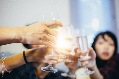 Asian group of friends having party with alcoholic beer drinks and Young people enjoying at a bar toasting cocktails