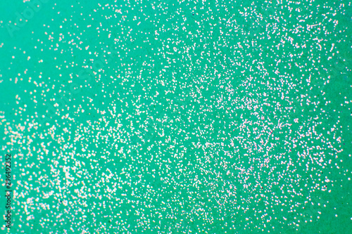 Foto Silver glitter on a mint background