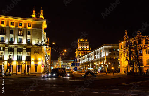 Night city with luminous streets. Buildings with beautifully colored lights.