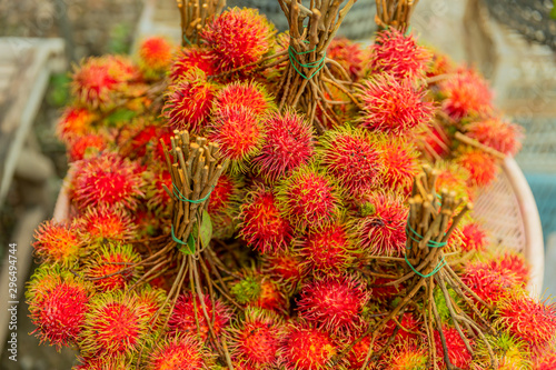 Fresh fruits rambutans background, Red rambutans and yellow rambutans in a  local market, © S@photo